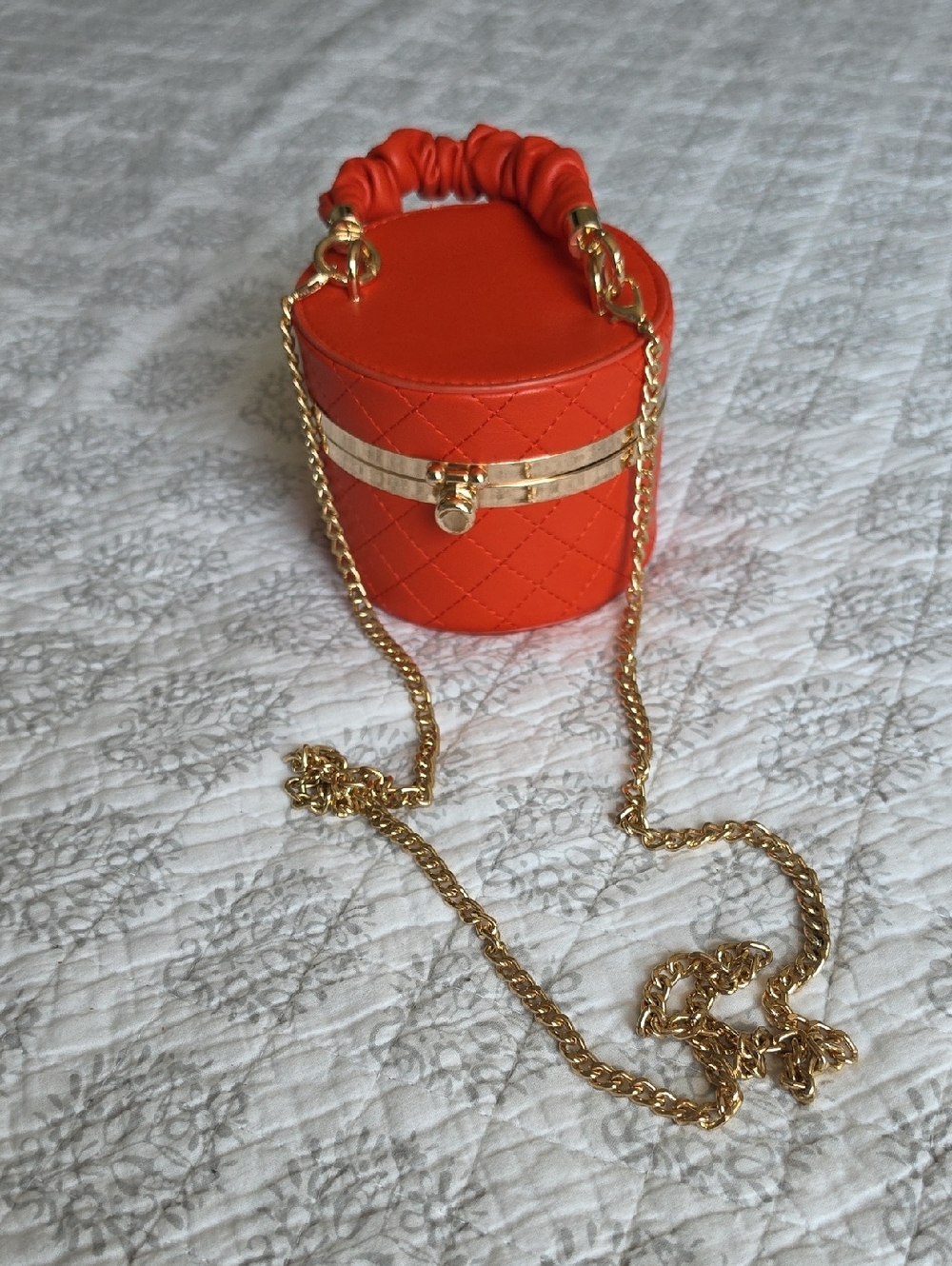 Orange Quilted Cylinder Crossbody Bag with Gold Chain